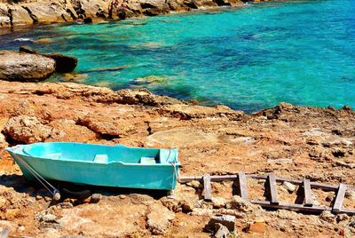 Boat moored on shore