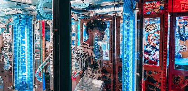 Portrait of young man standing in store