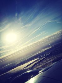 Aerial view of sea against cloudy sky