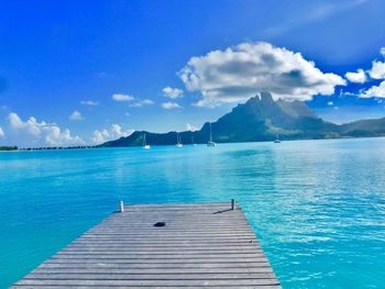 Scenic view of sea against blue sky