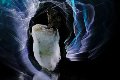 Close-up of ice cream over black background