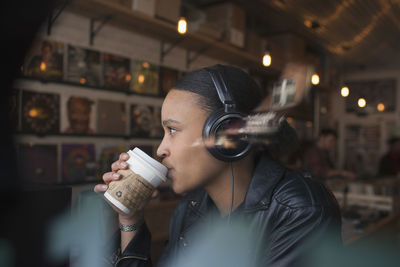 Portrait of man holding coffee cup