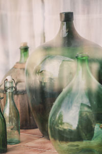 Close-up of glass bottles on table