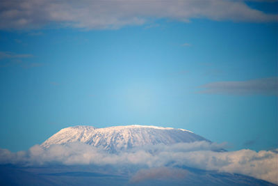 Scenic view of mountain against blue sky