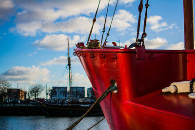 Boats in river with buildings in background