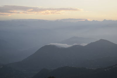 Scenic view of mountains against sky during sunset