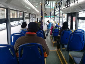 Rear view of people in train