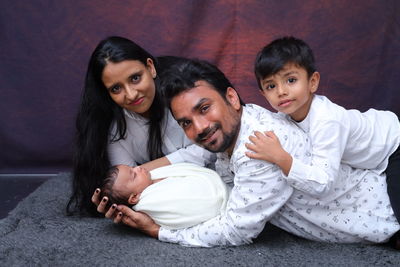 Photo of a family with their new born