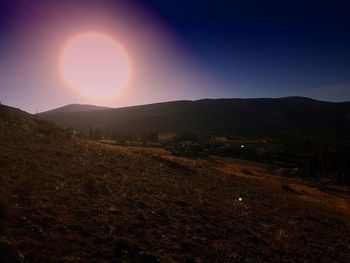 Scenic view of field against sky during sunset