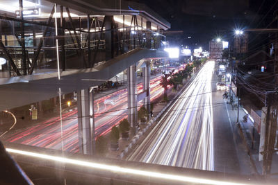 High angle view of light trails on road at night