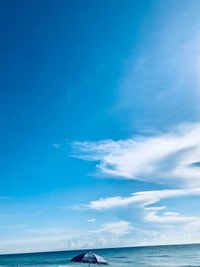 Scenic view of sea against blue sky