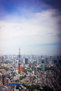 Cityscape against cloudy sky