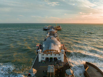 Aerial view of brighton palace pier, with the seafront behind.