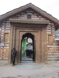 Man looking at entrance of building