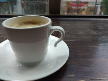 Close-up of coffee cup on table