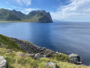 Scenic view of fjords and sea against sky