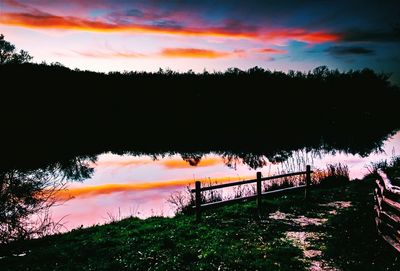 Scenic view of lake at sunset