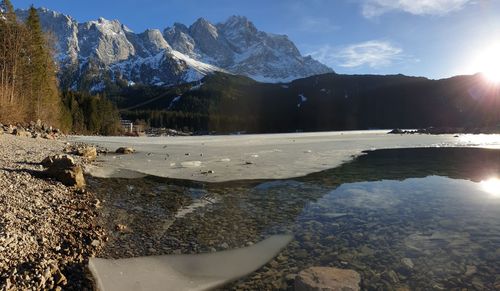 Scenic view of snowcapped mountains against sky