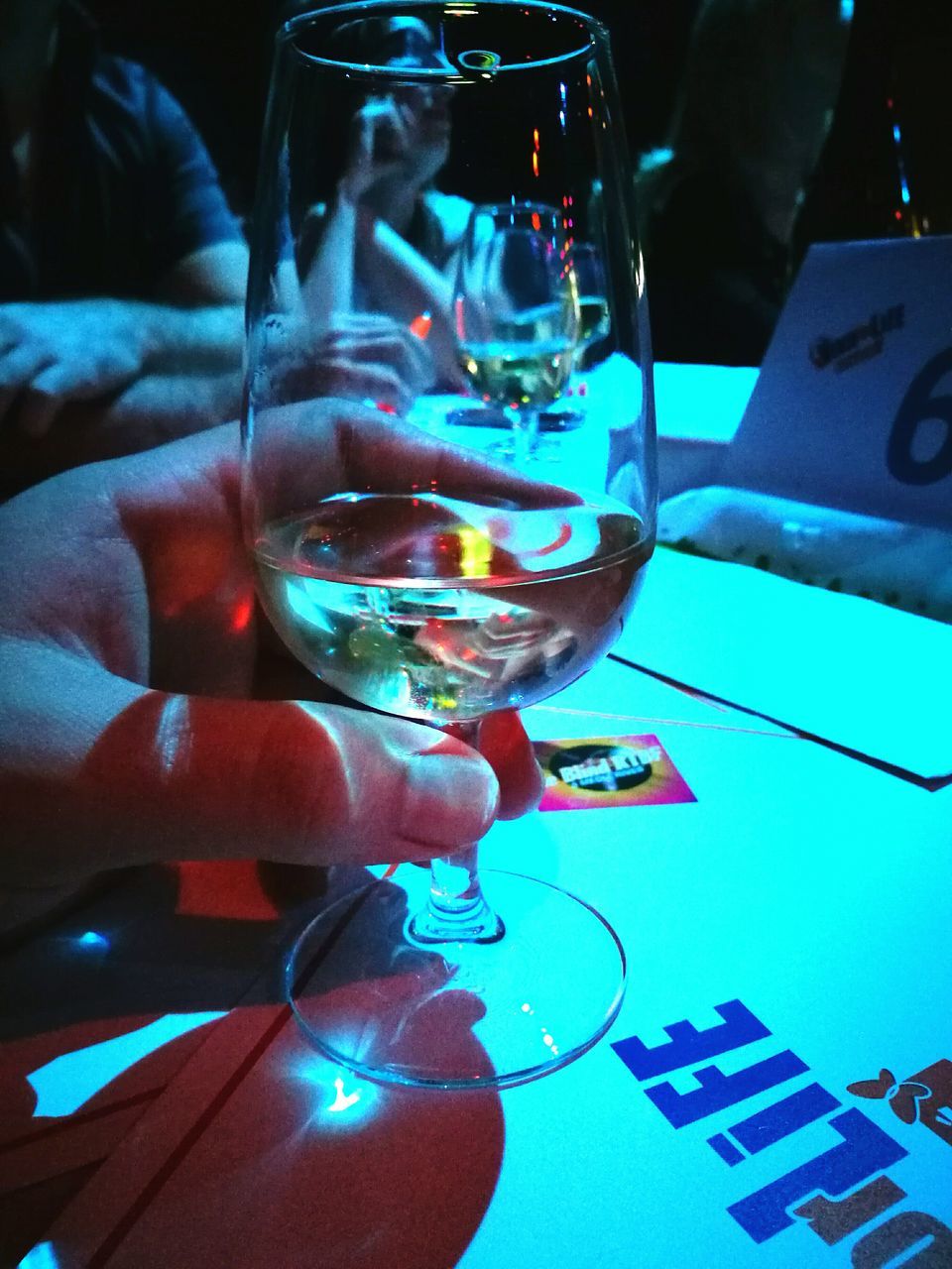 CLOSE-UP OF WOMAN DRINKING GLASS WITH WINE