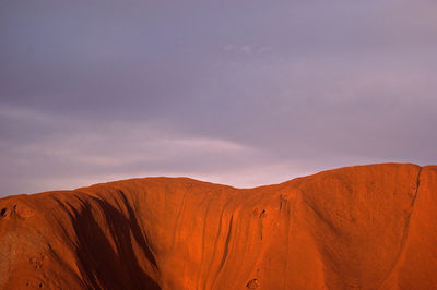 Scenic view of uluru against sky