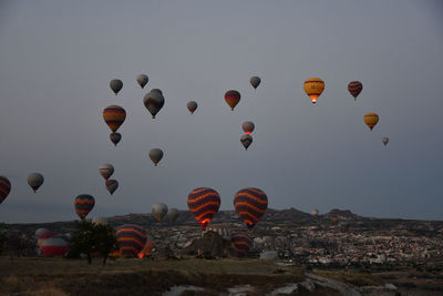 Countless hot air balloons in the gray dawn in cappadocia, turkey