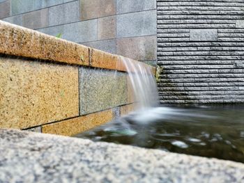 High angle view of water flowing from wall