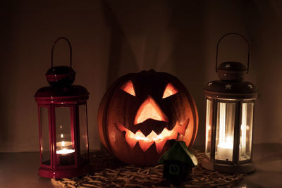 Close-up of illuminated lantern on table