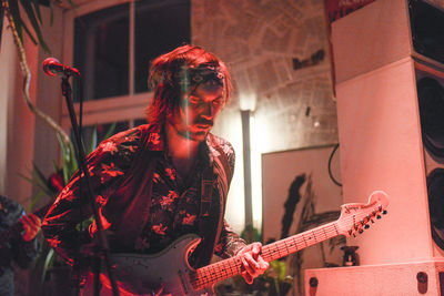 Young woman playing guitar