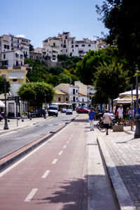 City street and buildings against sky