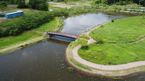 High angle view of swimming pool by canal