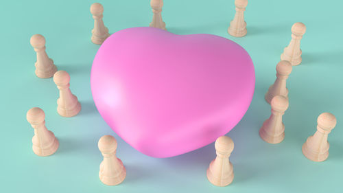 Close-up of multi colored balloons against blue background