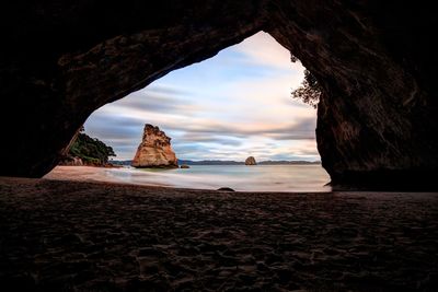 Scenic view of beach against sky during sunset