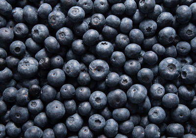 Big box with scattered fresh blueberries, fresh raw food, natural healthy food