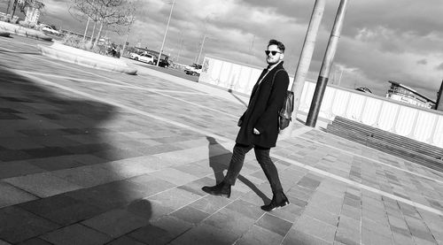 Woman walking on zebra crossing