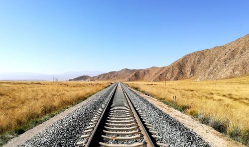 View of railroad tracks against clear sky