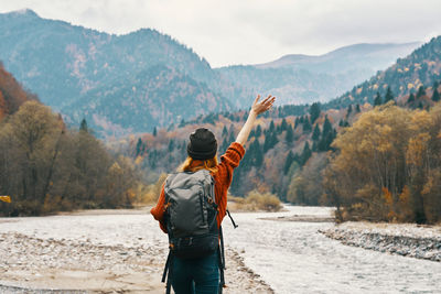 Rear view of man standing on mountain