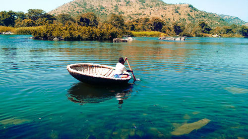 People in boat on lake