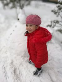 Portrait of smiling girl in snow