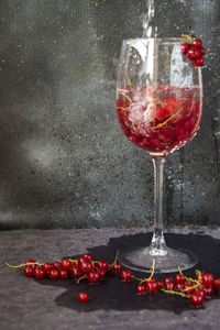 Close-up of wine glass against black background