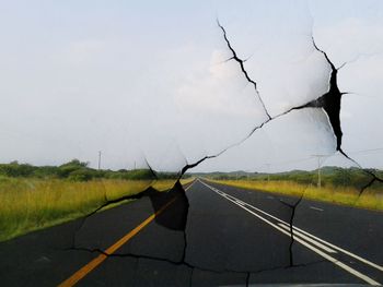 Road passing through field