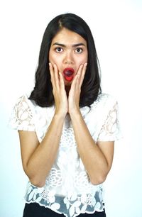 Portrait of a beautiful young woman over white background