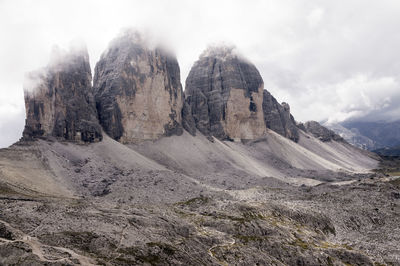 Rocky mountains against clouds