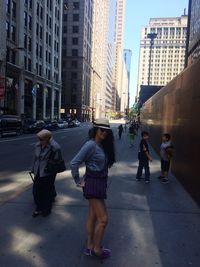 Woman walking on city street