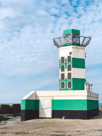 Built structure on beach against sky