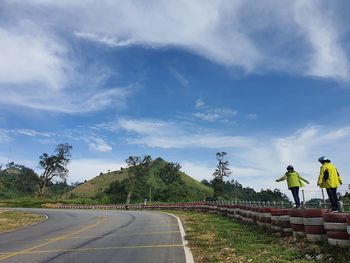 People on road against sky