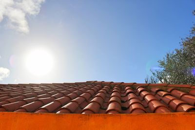 Low angle view of roof against blue sky