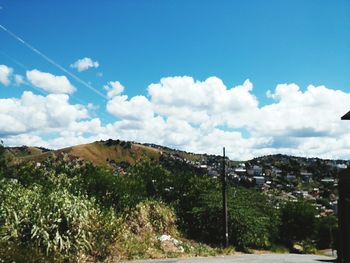 Scenic view of landscape against cloudy sky