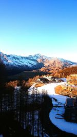 Scenic view of mountains against clear sky during winter