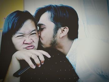 Portrait of young couple at home