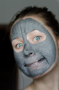 Portrait of young woman wearing facial mask